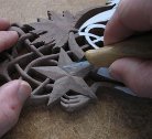 photograph of David Western carving a lovespoon